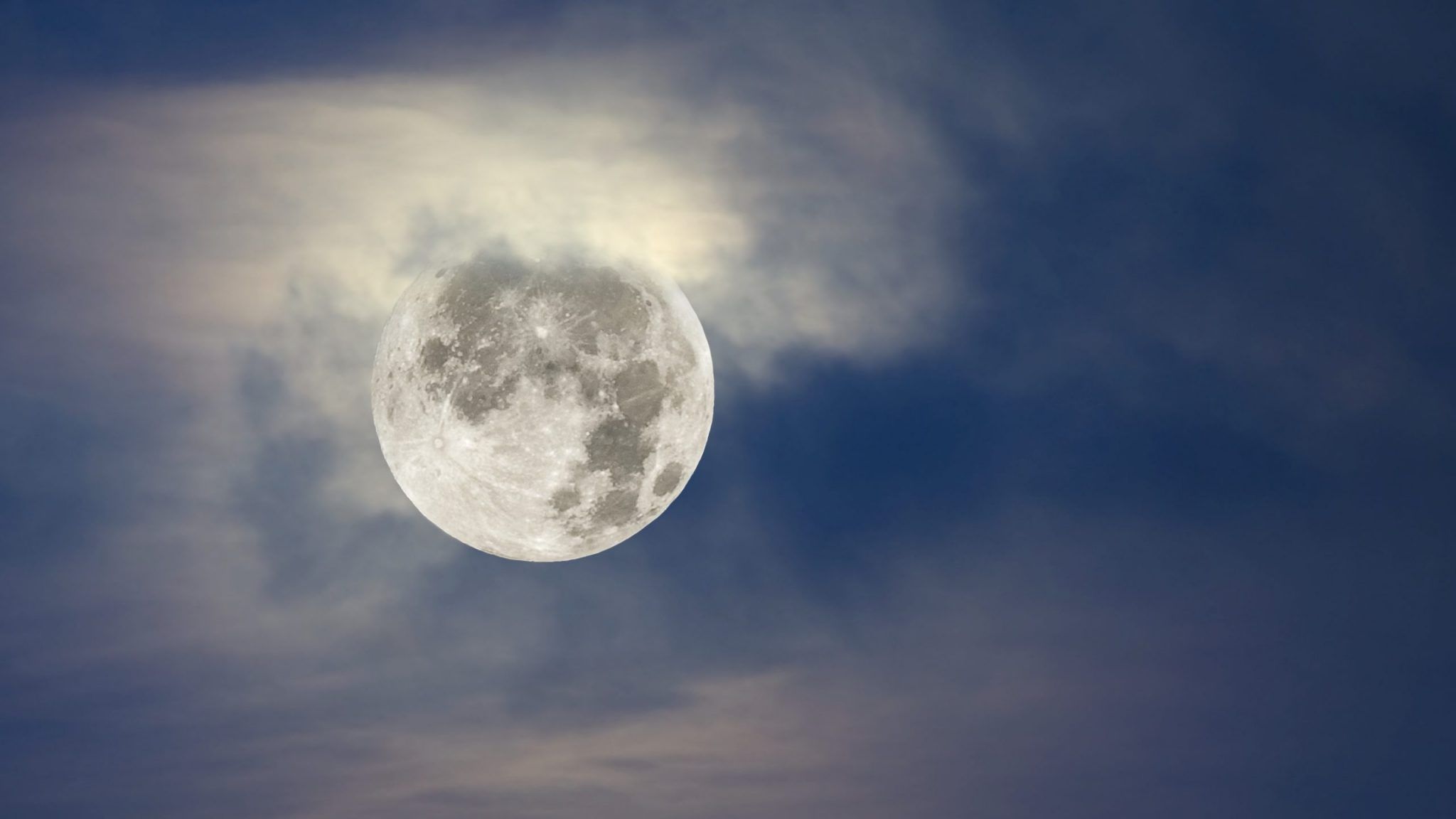 Full moon and cloudy sky