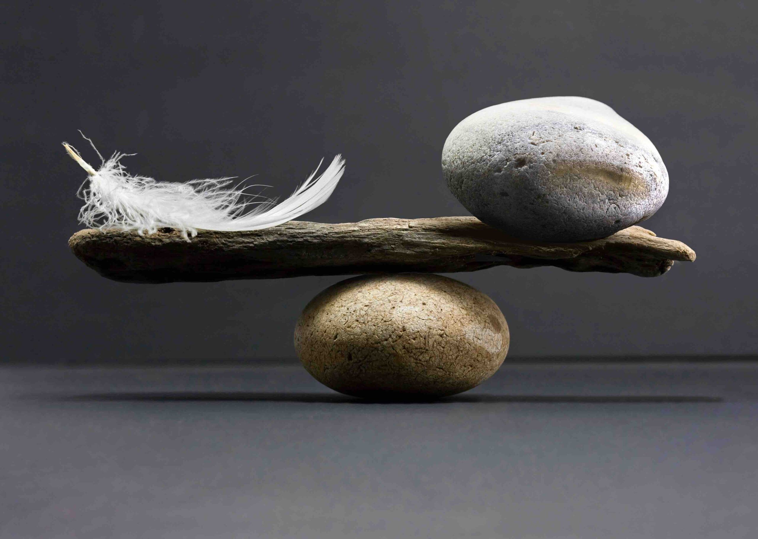feather and stone balance